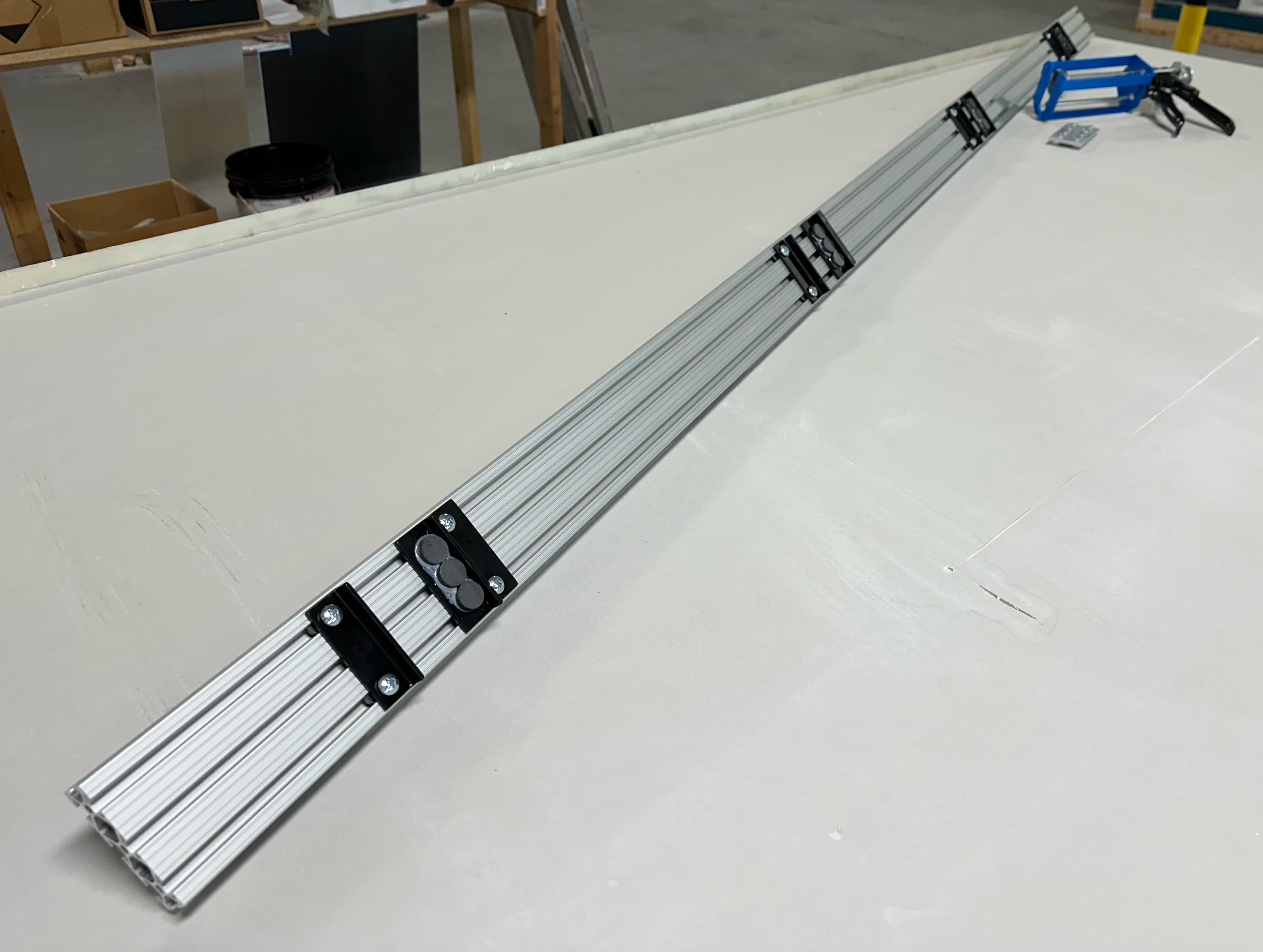 The alignment jig laid across a panel